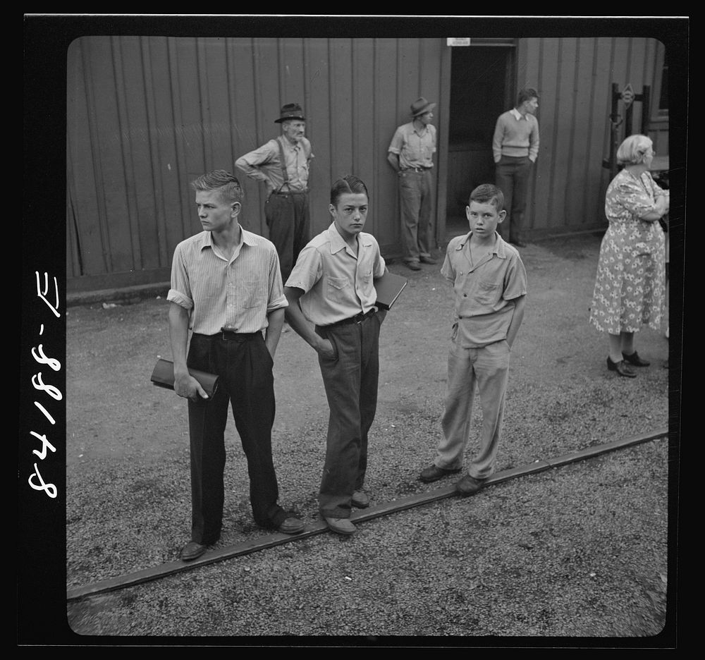 Richwood, West Virginia. These boys stayed at home when the special train left Richwood carrying agricultural workers to…