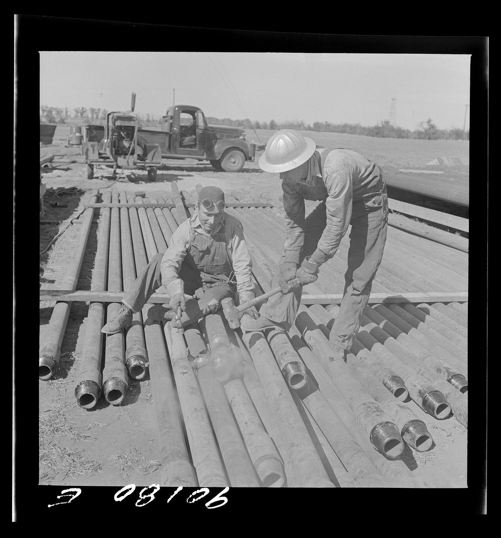 [Untitled photo, possibly related to: Floyd Swick, welder from Newton, Kansas worked in oil fields about ten years; cutting…