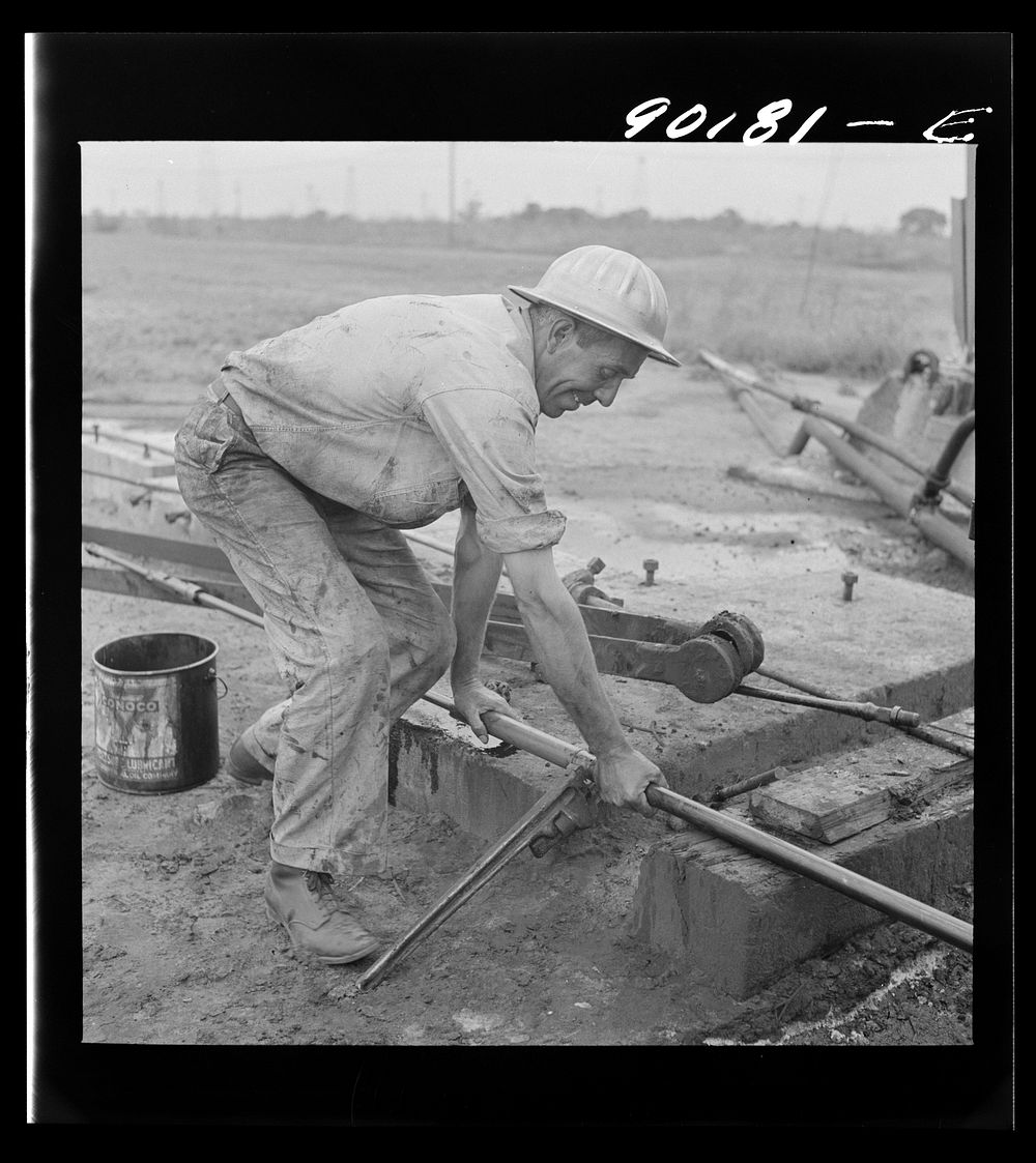 Servicing an old oil well near Wichita, Kansas. Sourced from the Library of Congress.
