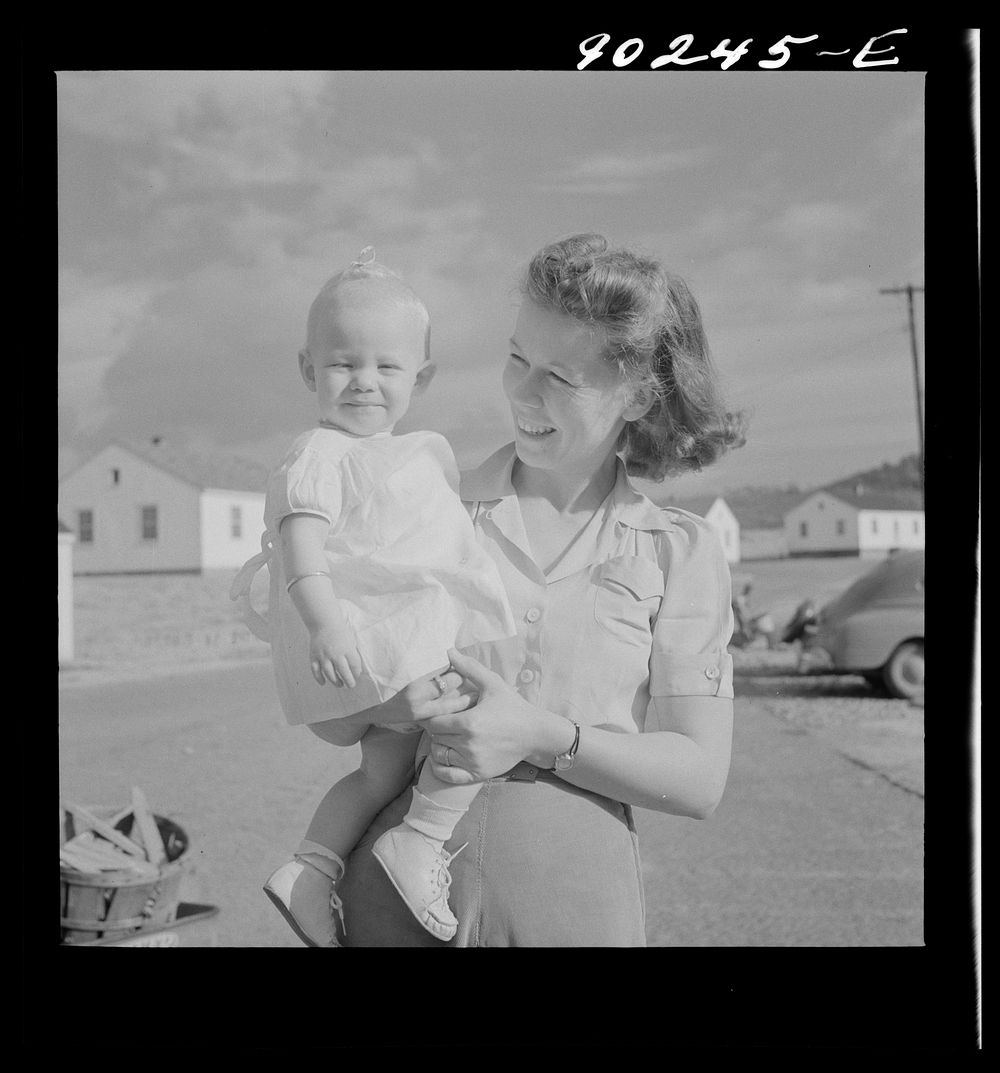 [Untitled photo, possibly related to: Mrs. B.M. Henderson, wife of defense worker, and daughter, who live in Sunset Village.…