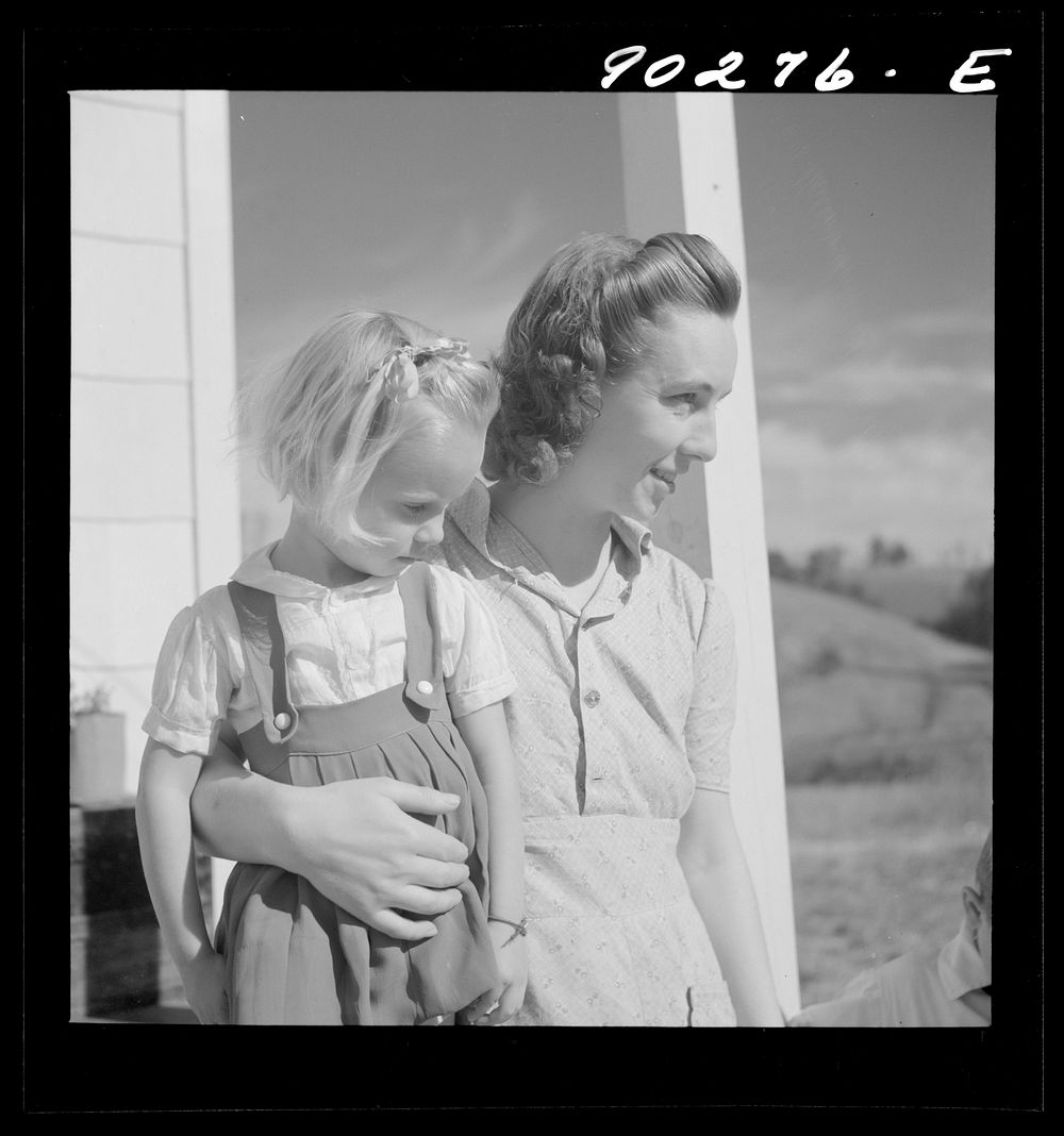 Mrs. Howard H. Smith and daughter from Galax by rural home built by FSA (Farm Security Administration) for defense workers…