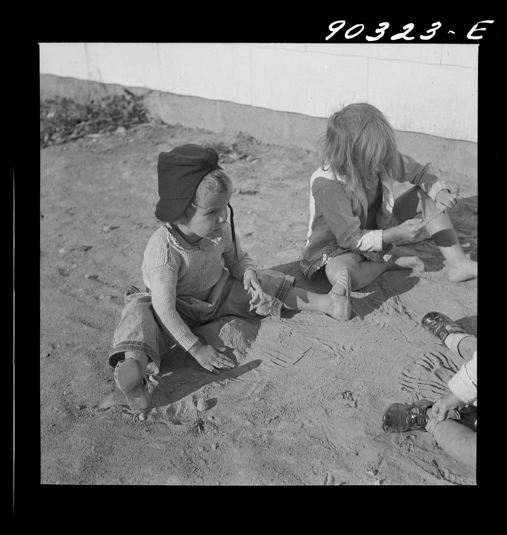 Children of defense workers playing outside their home in Sunset Village. FSA (Farm Security Administration) housing…