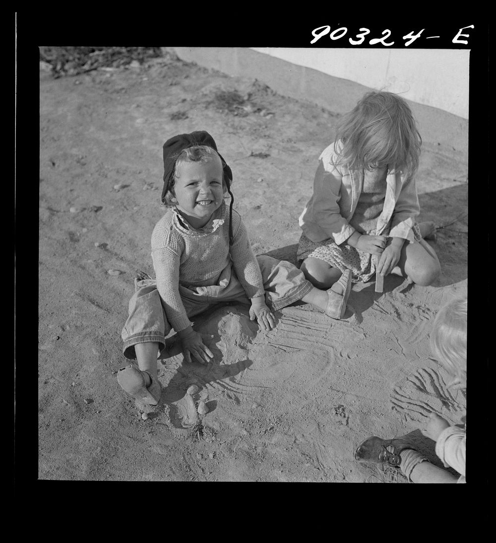 Children of defense workers playing outside of their homes in Sunset Village. FSA (Farm Security Administration) housing…