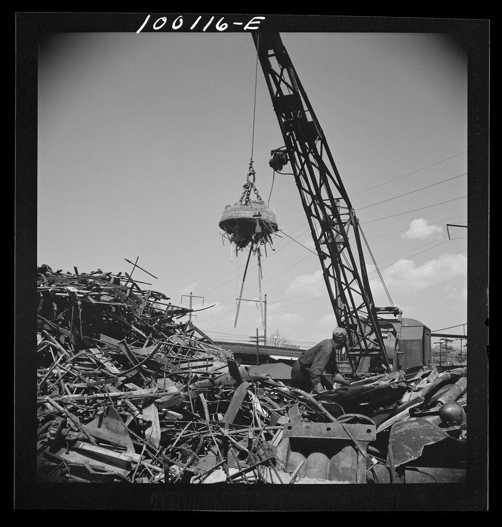 [Untitled photo, possibly related to: Washington, D.C. Scrap salvage campaign, Victory Program. Electro-magnet loads metal…