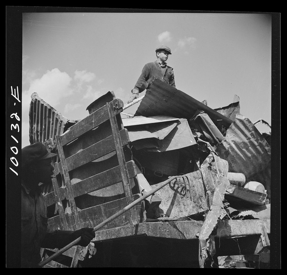 Washington, D.C. Scrap salvage campaign, Victory Program. Unloading metal scrap from a truck at a wholesale junkyard.…