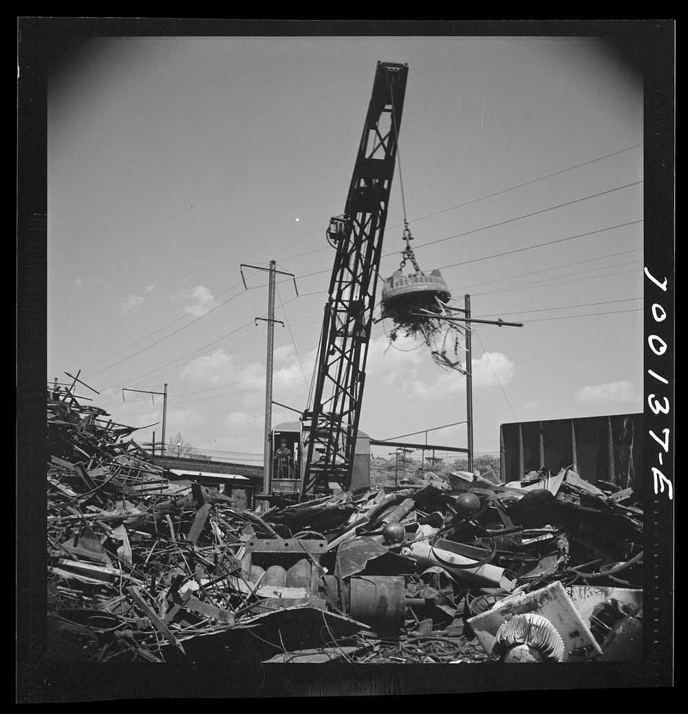 [Untitled photo, possibly related to: Washington, D.C. Scrap salvage campaign, Victory Program. Electro-magnet loads metal…