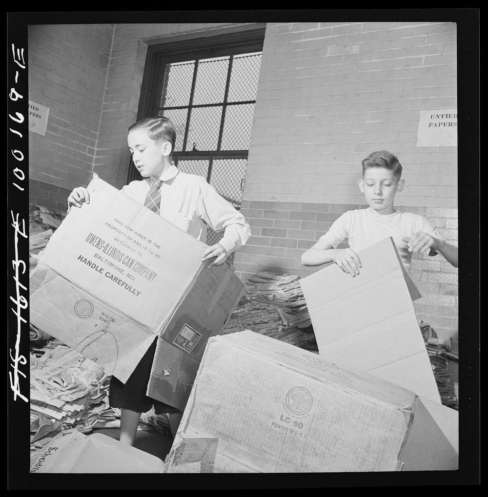 Washington, D.C. Scrap salvage campaign, Victory Program. Washington schoolchildren fold cartons so that they will pack flat…