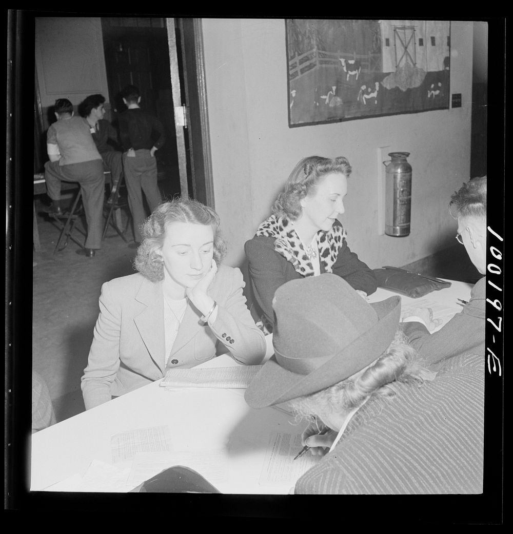 Residents of one of Washington's best residential sections apply for sugar ration cards at Adams School. Sourced from the…