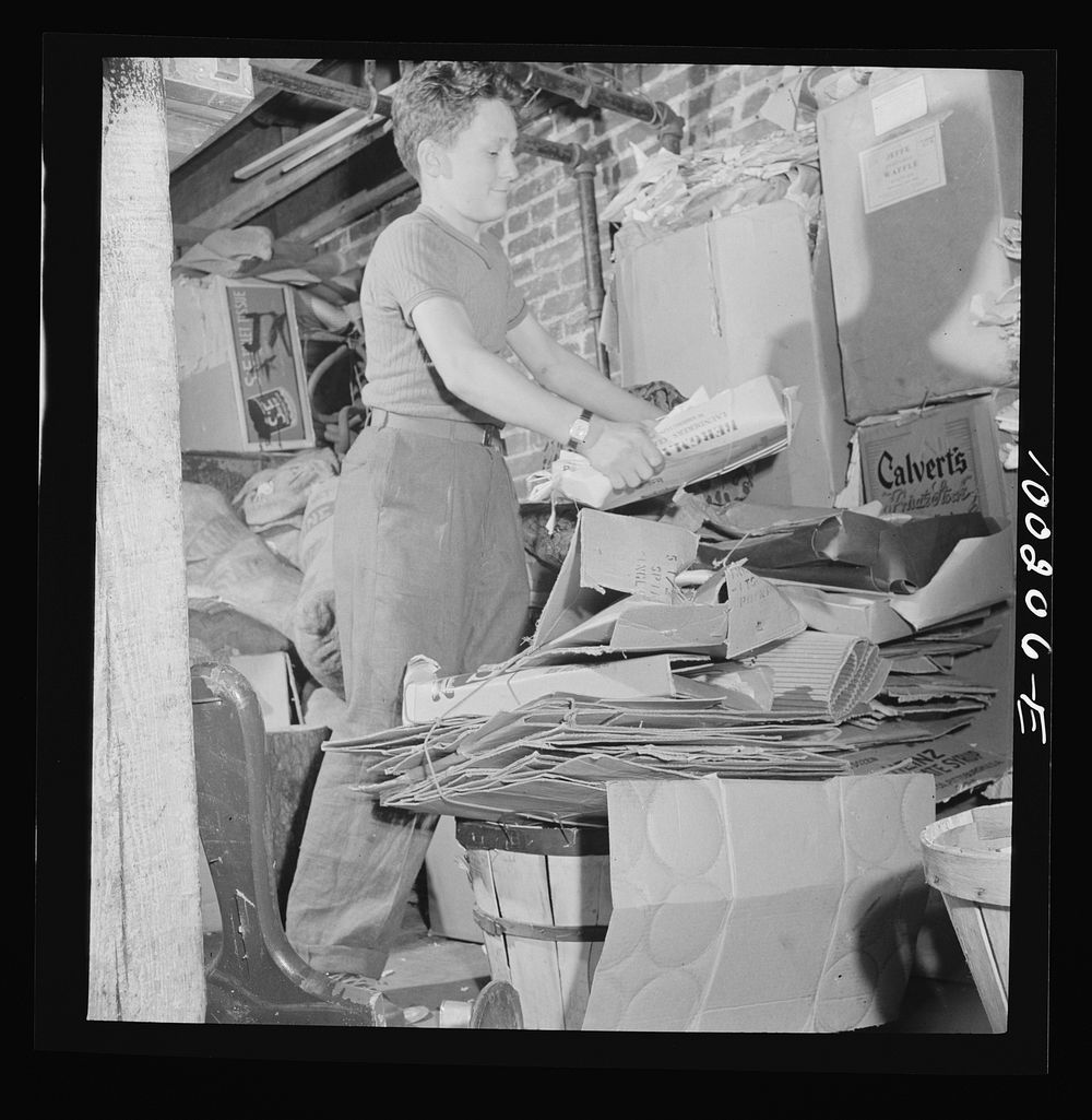 Washington, D.C. Scrap salvage campaign, Victory Program. This boy keeps stacks of paper, metal and rags in his cellar…