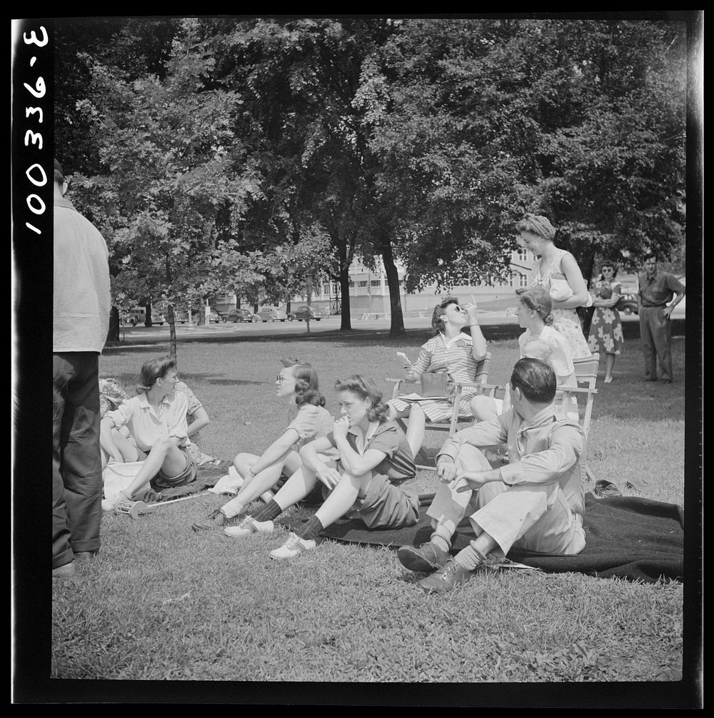 Washington, D.C. Audience of wives watching their husbands play amateur baseball on a diamond near Lincoln Memorial on…