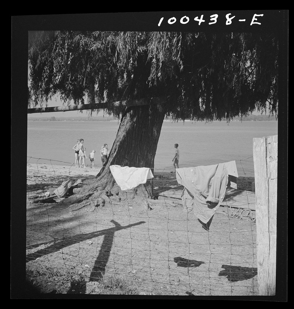 St. Mary's County, Maryland. Sunday school picnic on the edge of the Patuxent River. Some waded and some swam at the…