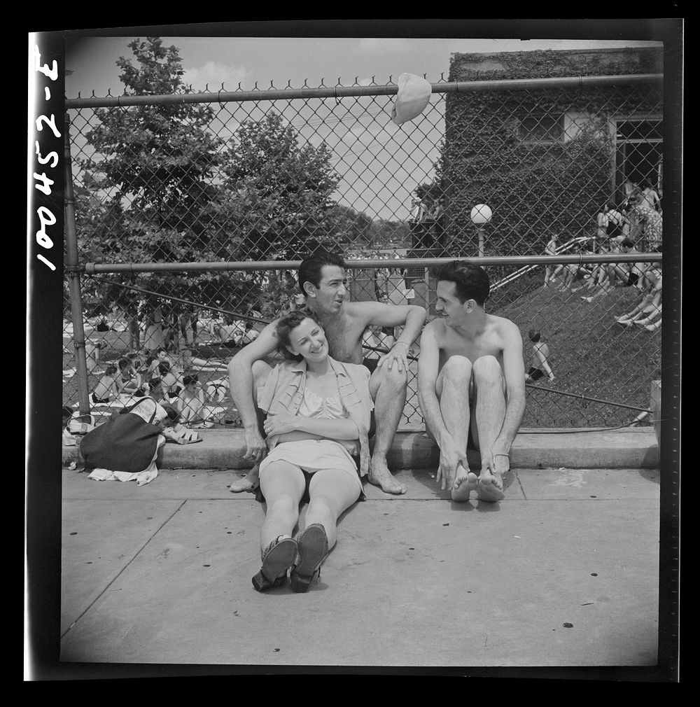 Washington, D.C. Relaxing on the edge of the municipal swimming pool on Sunday. Sourced from the Library of Congress.