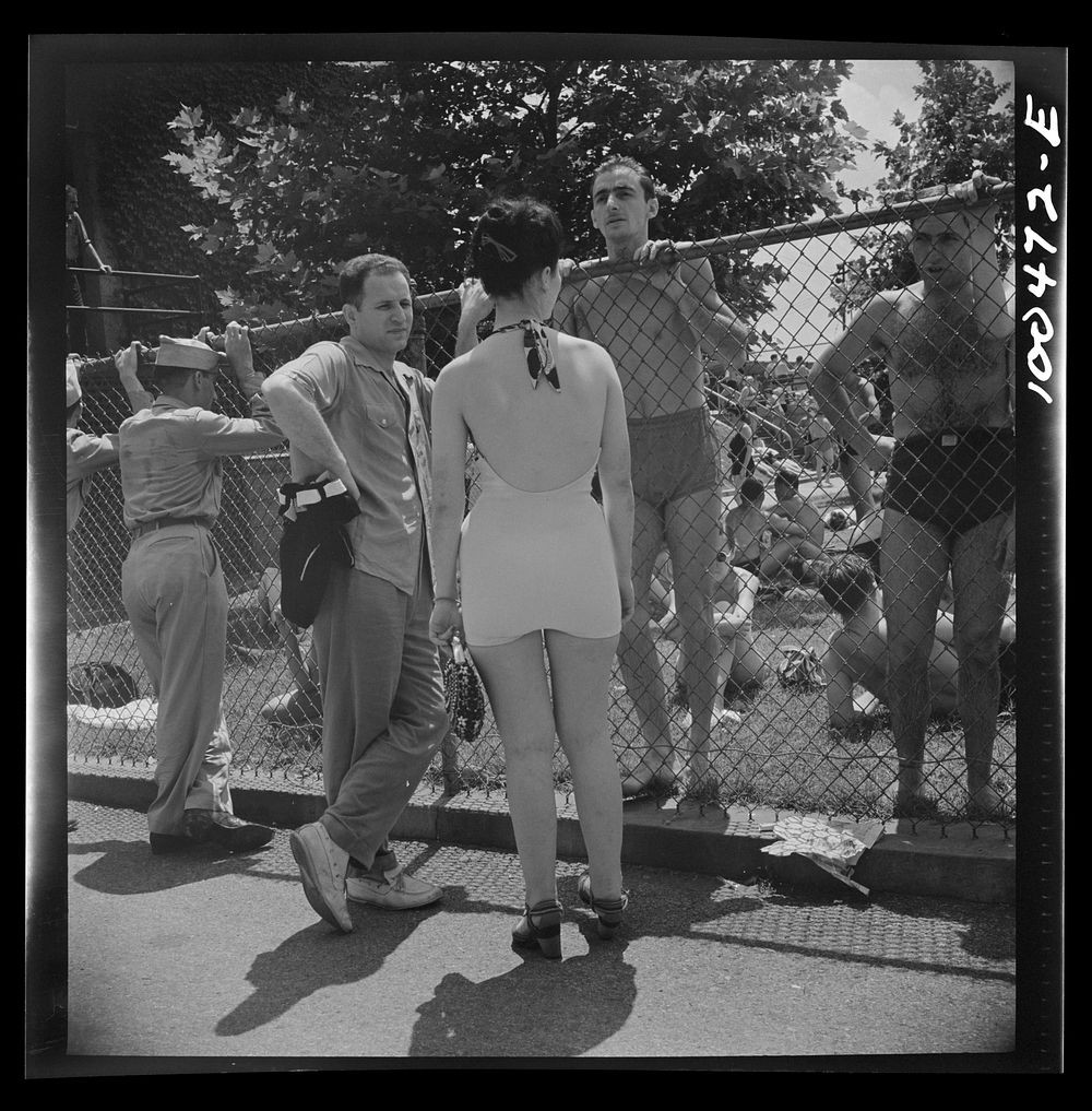 Washington, D.C. Sunday crowds are so great at the municipal swimming pool that long lines form awaiting their turn. Sourced…