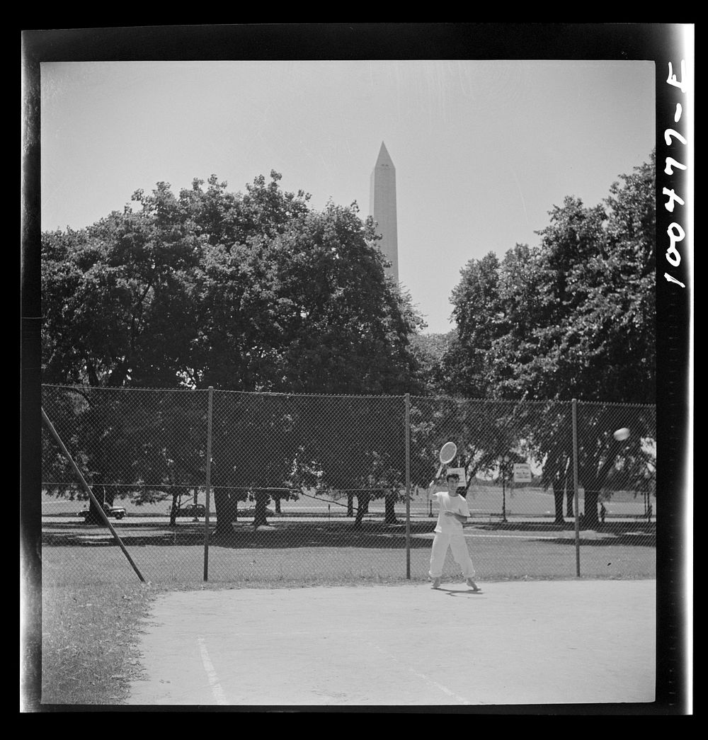 Washington, D.C. Playing tennis in the park in front of the U.S. Department of Commerce building on Sunday afternoon.…