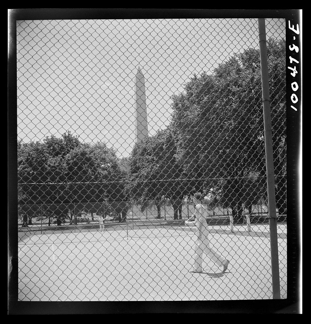 Washington, D.C. Playing tennis in the park in front of the U.S. Department of Commerce building on Sunday afternoon.…