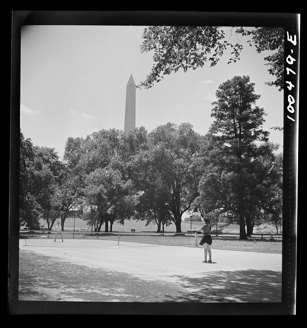 [Untitled photo, possibly related to: Washington, D.C. Playing tennis in the park in front of the U.S. Department of…