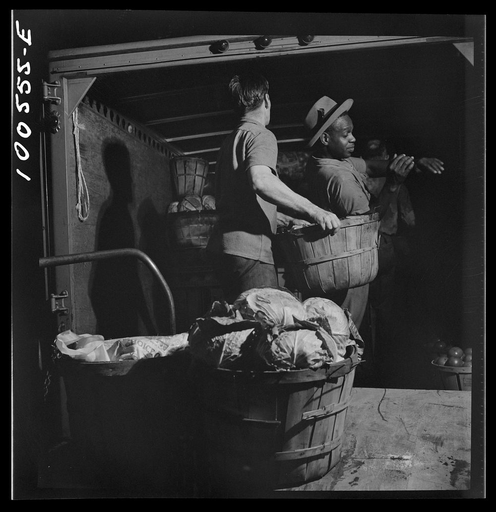[Untitled photo, possibly related to: Washington, D.C. Unloading potatoes and cabbage at the District grocery store…