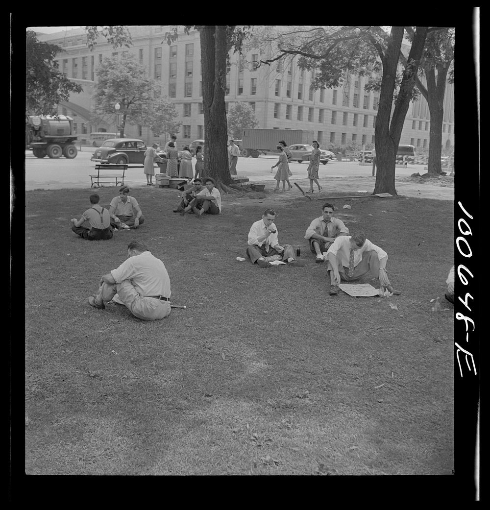 [Untitled photo, possibly related to: Washington, D.C. Government workers lunching and resting in Washington Monument park…