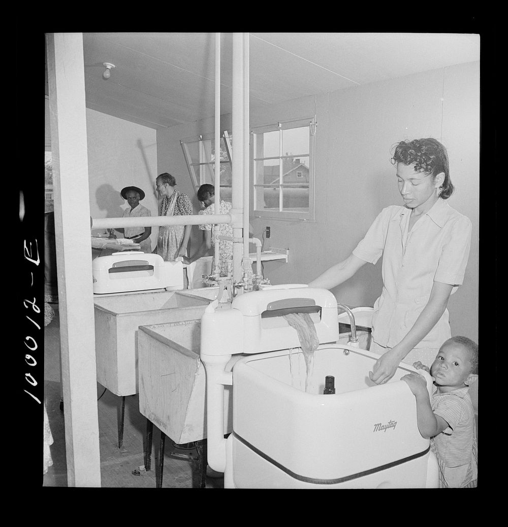 Arlington, Virginia. FSA (Farm Security Administration) trailer camp project for es. Well-equipped laundry in the community…