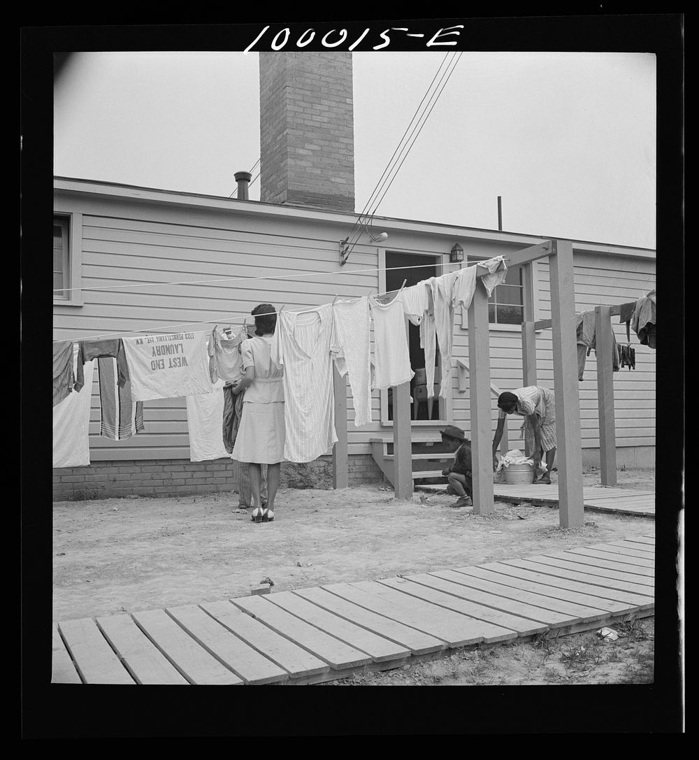 Arlington, Virginia. FSA (Farm Security Administration) trailer camp project for es. Hanging out washing in front of the…