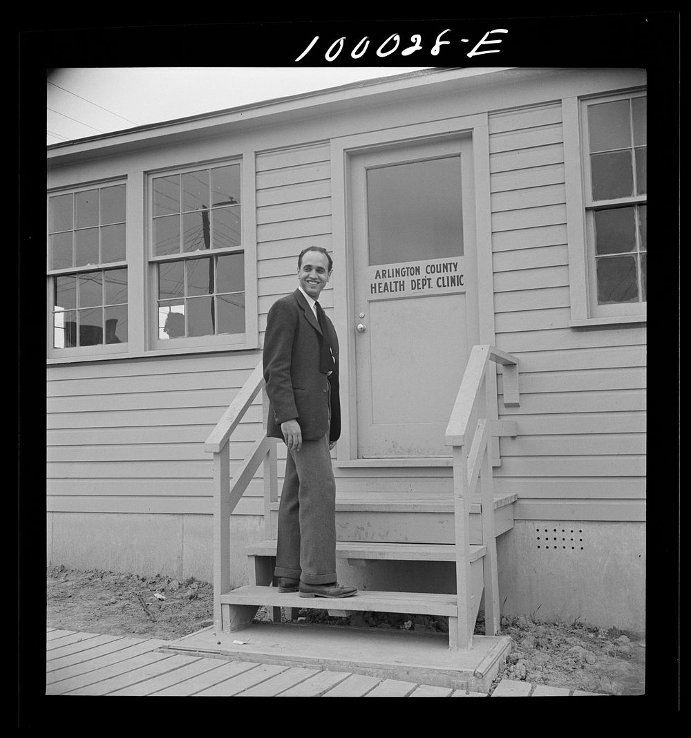 Arlington, Virginia. FSA (Farm Security Administration) trailer camp project for es. Manager of the project outside the…