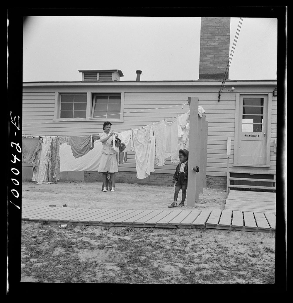 Arlington, Virginia. FSA (Farm Security Administration) trailer camp project for es. Hanging out wash in front of the…