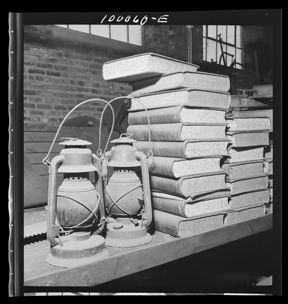 Washington, D.C. Salvage drive, Victory Program. Books and old lantern stored in District wholesale junk company warehouse.…