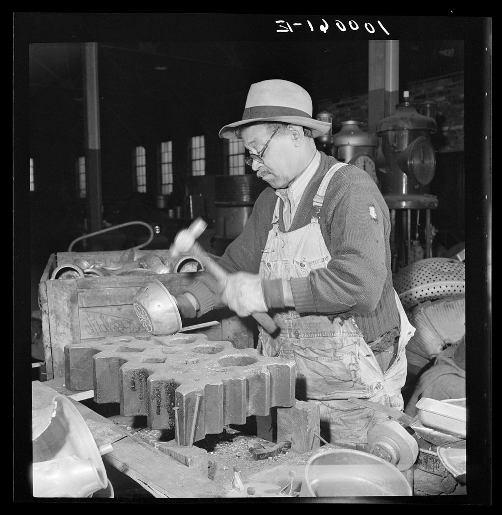 Washington, D.C. Salvage drive, Victory Program. "Cleaning" metal by hammering off parts to separate kinds of metal. Sourced…