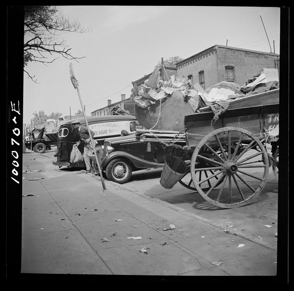 Washington, D.C. Salvage drive, Victory Program. Variety of junk-bearing vehicles parked outside. District retail junk…