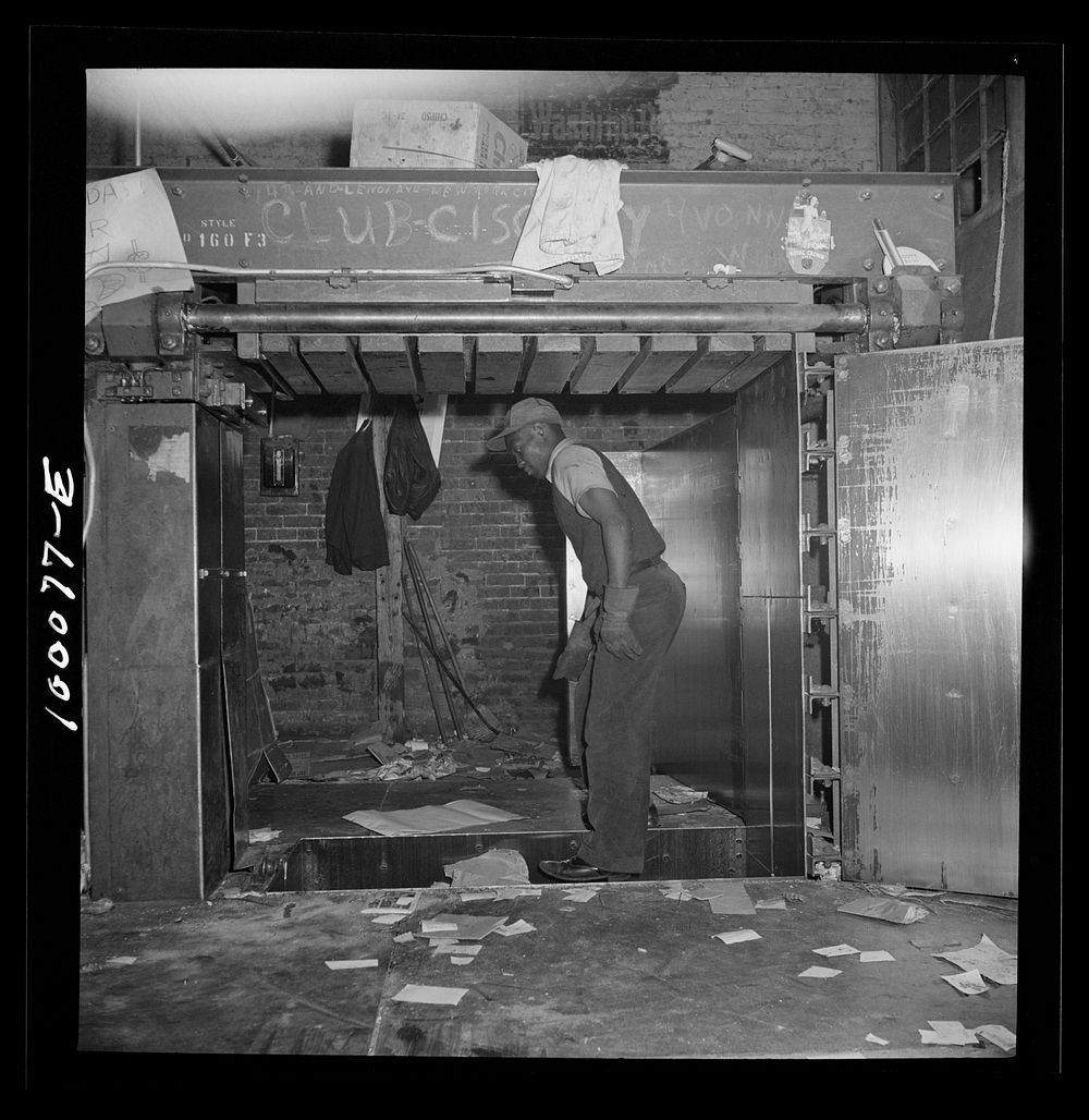 Washington, D.C. Scrap salvage campaign, Victory Program. Stamping on scrap paper which has been loaded into a hydraulic…