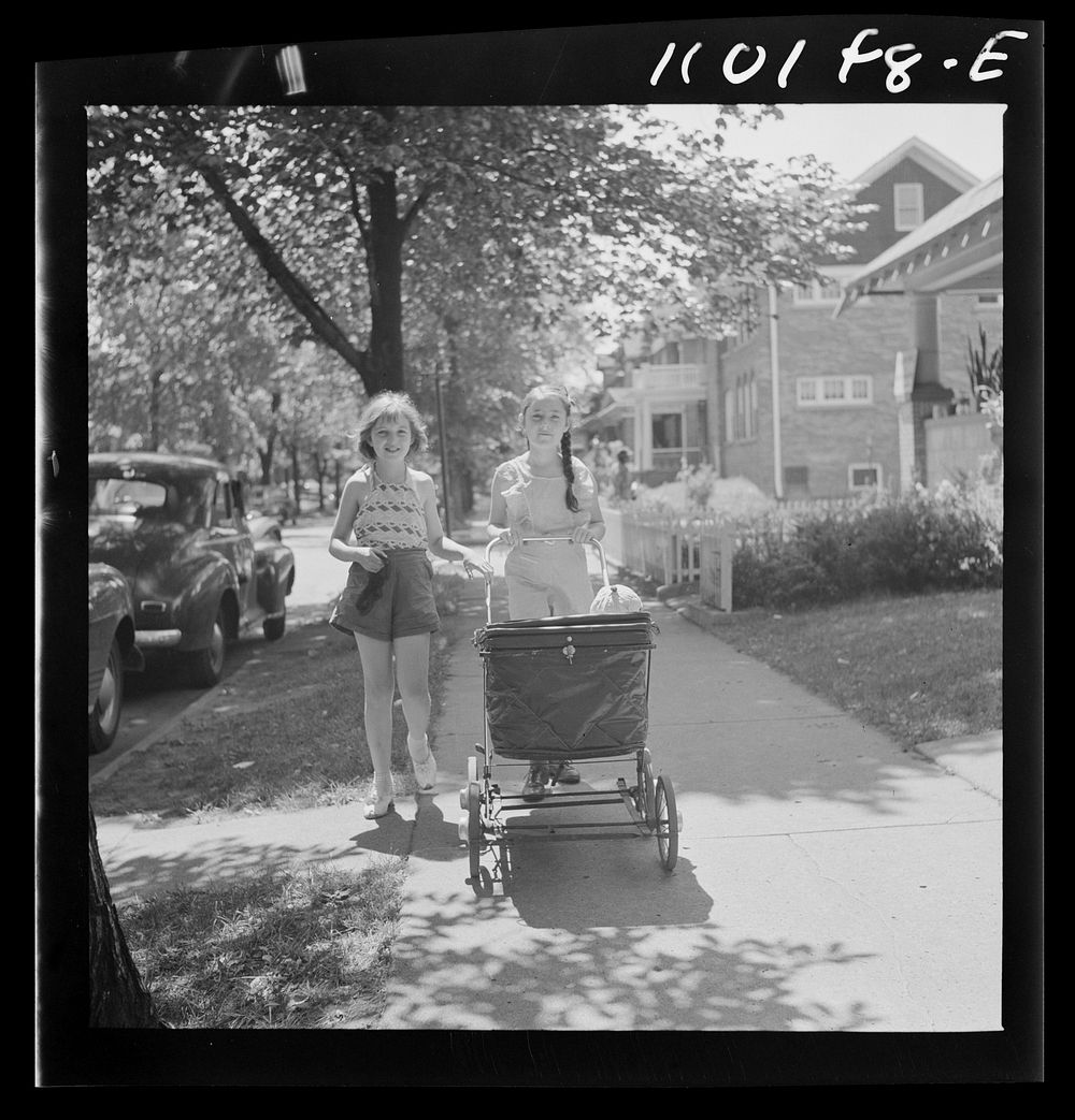 Detroit, Michigan. Little girl pushing a carriage. Sourced from the Library of Congress.