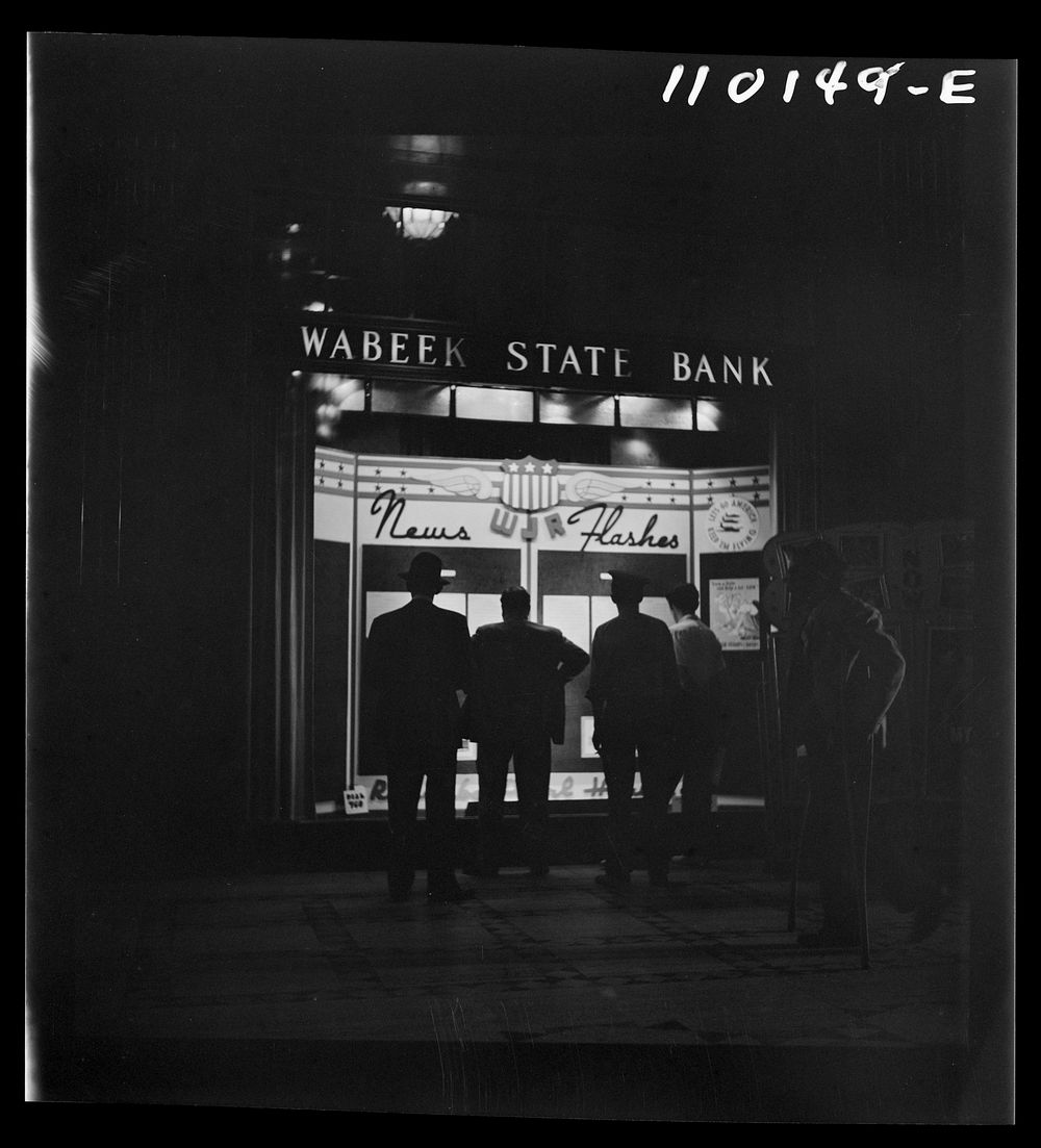 [Untitled photo, possibly related to: Detroit, Michigan. Spectators watching news flashes in a window]. Sourced from the…