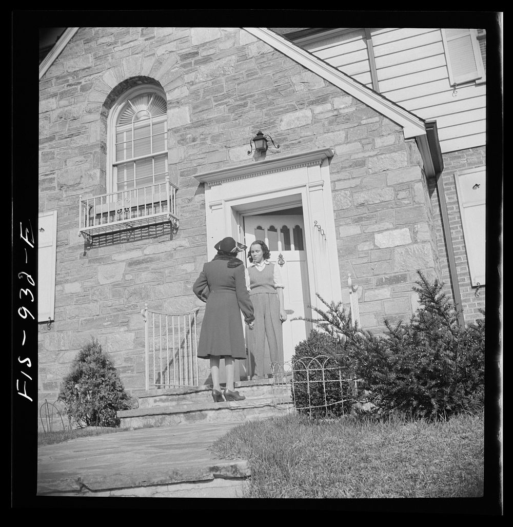 Washington, D.C. Teacher being greeted by her daugther as she comes home from work. Sourced from the Library of Congress.