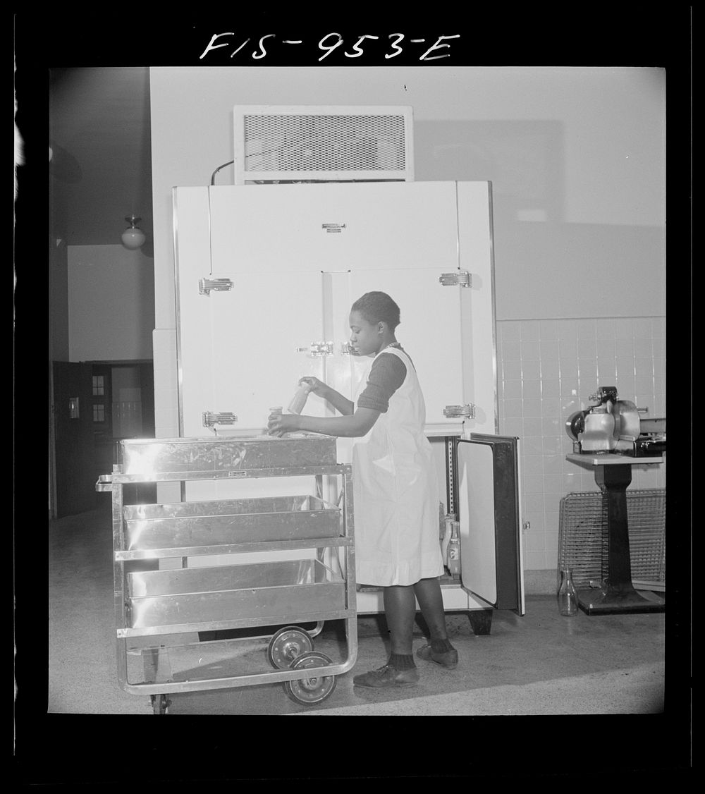 [Untitled photo, possibly related to: Washington, D.C. Students help prepare lunch for the school cafeteria at the Armstrong…