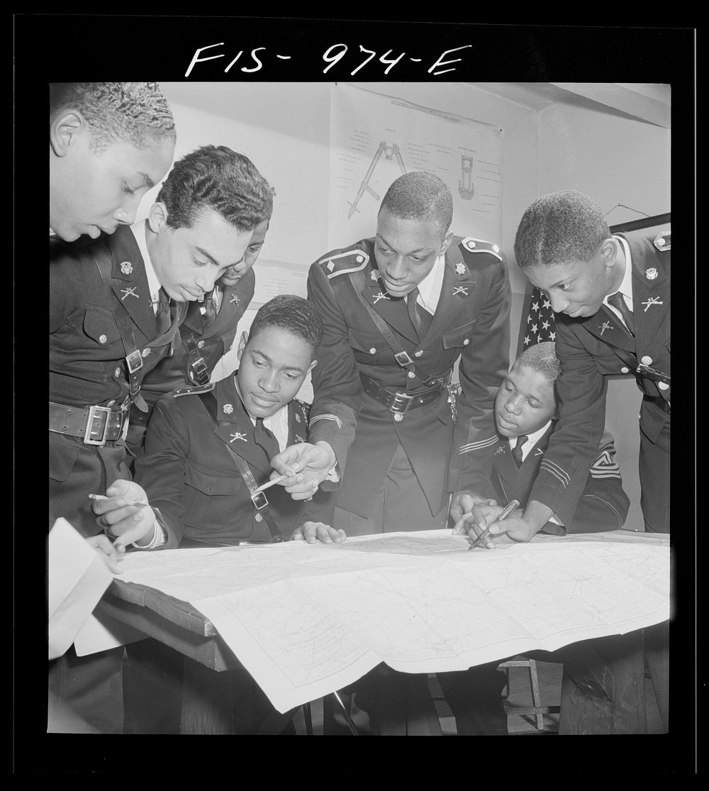 Washington, D.C. Members of the military unit at the Armstrong Technical High School studying a map. Sourced from the…
