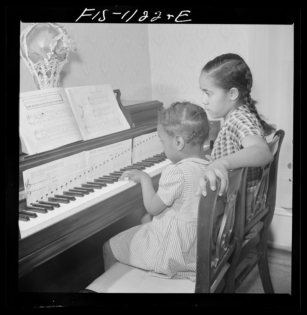 Washington, D.C. All the family of Jewal Mazique [i.e. Jewel], worker at the Library of Congress, takes music lessons.…