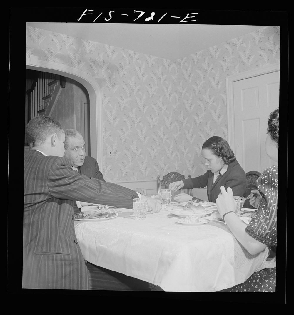 [Untitled photo, possibly related to: Washington, D.C.  family at dinner. The husband is a doctor, the wife a teacher, the…