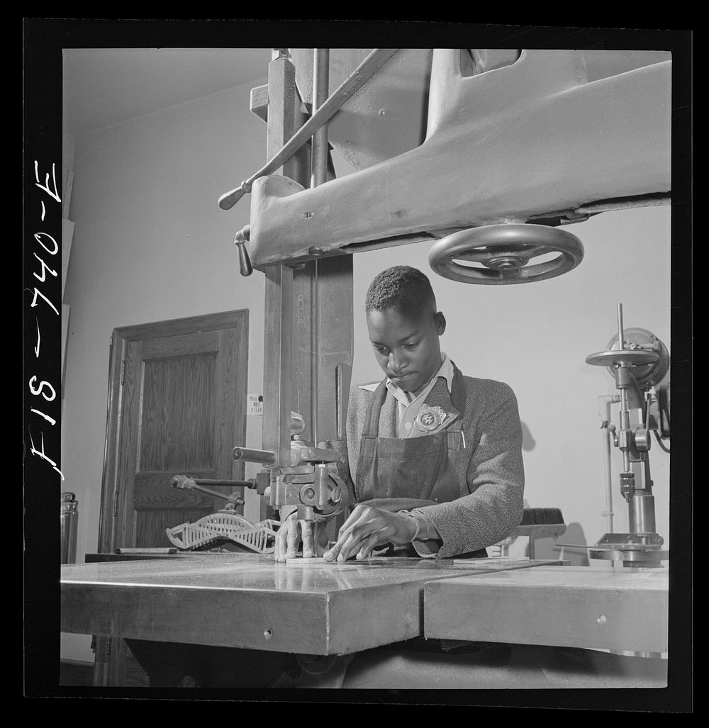 Washington, D.C. Using an electric drill to make model airplanes for the U.S. Navy at the Armstrong Technical High School.…