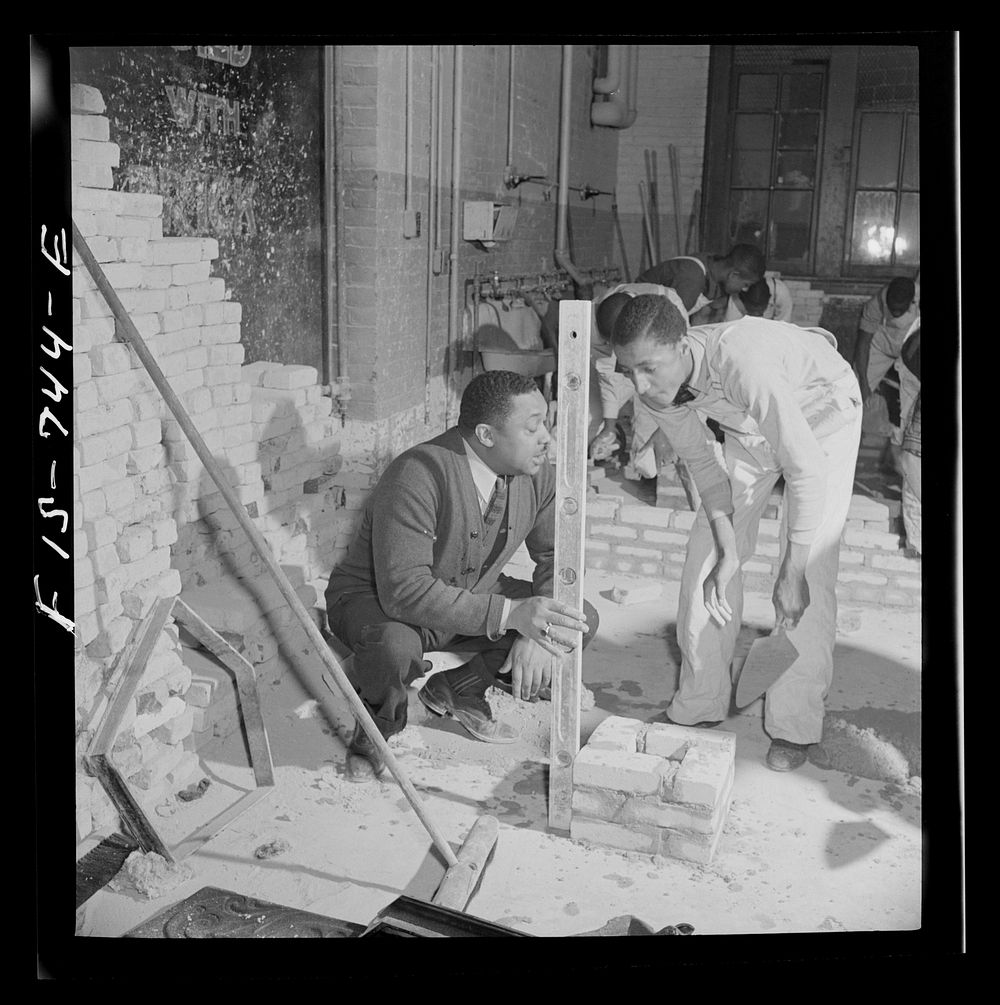 [Untitled photo, possibly related to: Washington, D.C. Bricklaying class at the Armstrong Technical High School]. Sourced…