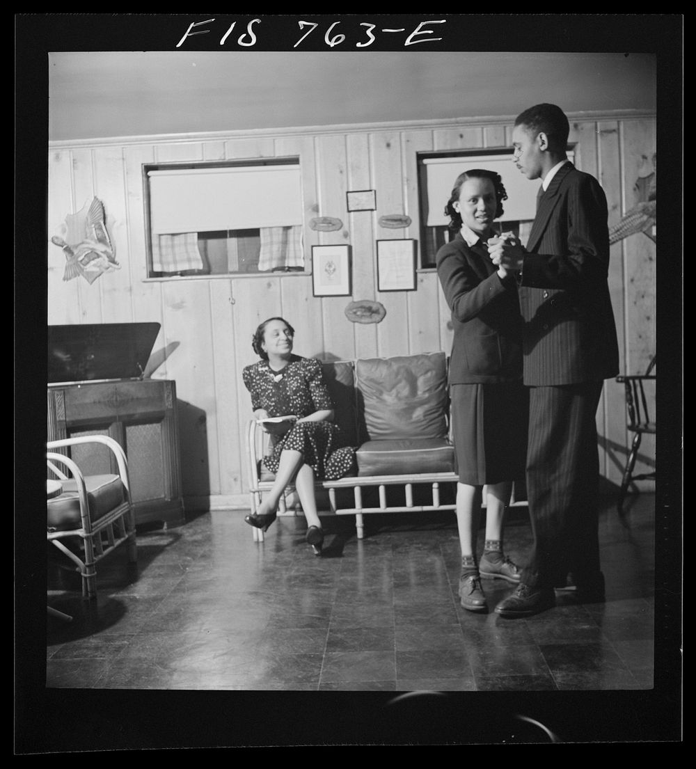 [Untitled photo, possibly related to: Washington, D.C.  school teacher whose husband is a doctor watching her son and…