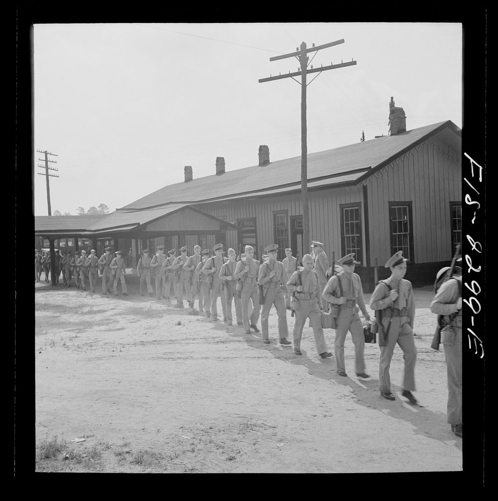 Parris Island, South Carolina. U.S. Marine Corps glider detachment training camp. Recruits on their way to the camp. Sourced…