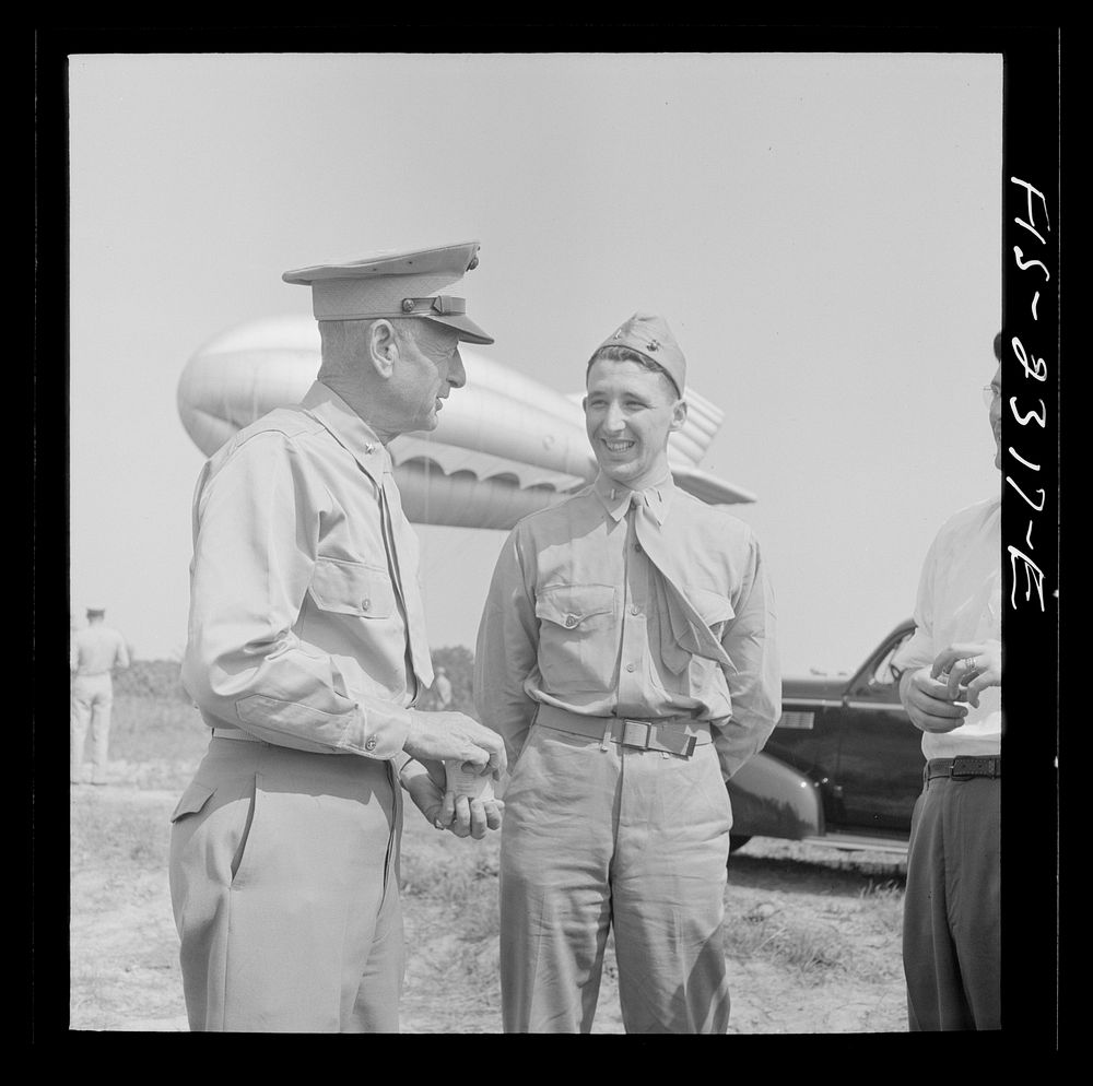 Parris Island, South Carolina. Brigadier General Emile Moses talking over barrage balloon tactics with a Marine Corps…