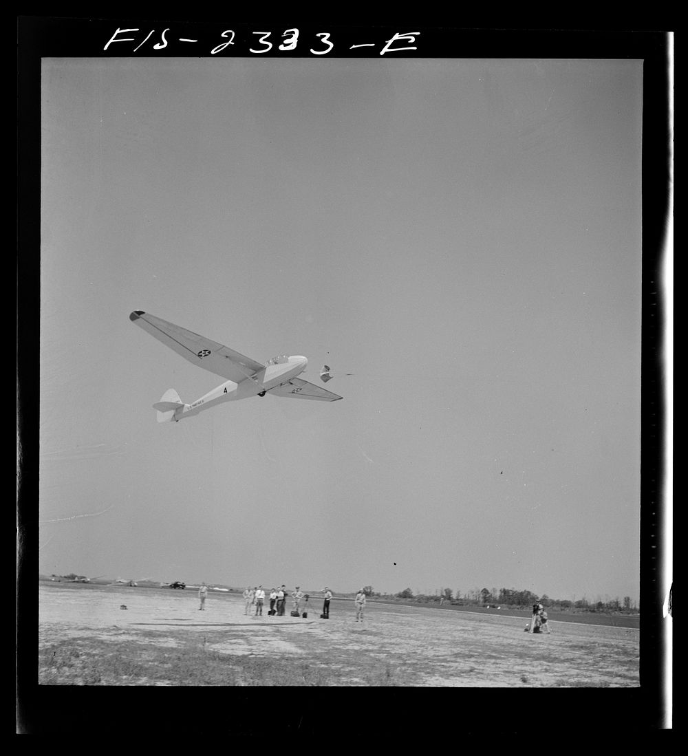Parris Island, South Carolina. A glider plane being towed over a a field at the U.S. Marine Corps glider detachment training…