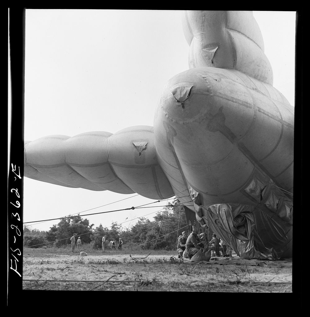 Parris Island, South Carolina. Special Marine units in training bedding down a big barrage balloon. Sourced from the Library…