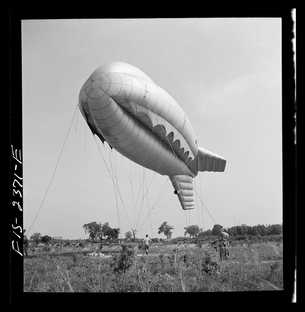 Parris Island, South Carolina. Tactical formations of barrage balloons prevent dive bombing and the strafing of important…