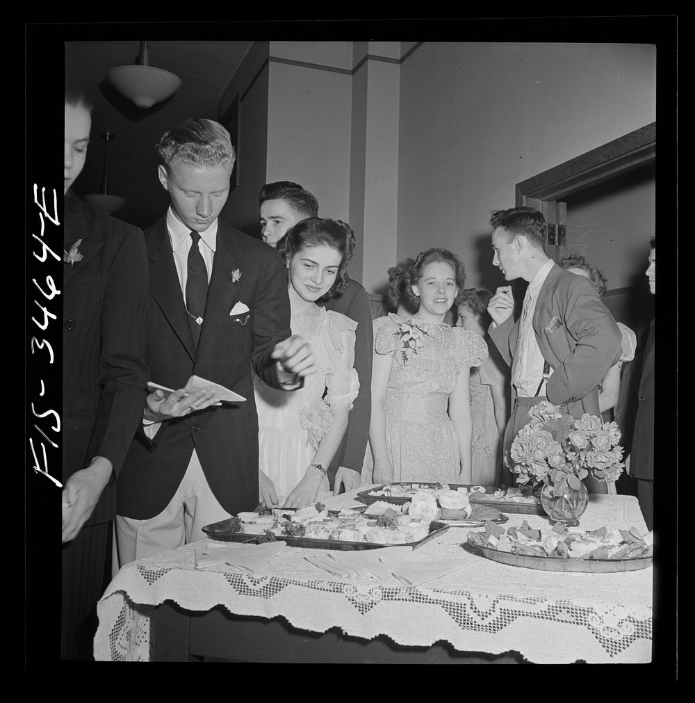 Greenbelt, Maryland. Federal housing project. Cakes and grape punch during intermission at the senior prom. Sourced from the…