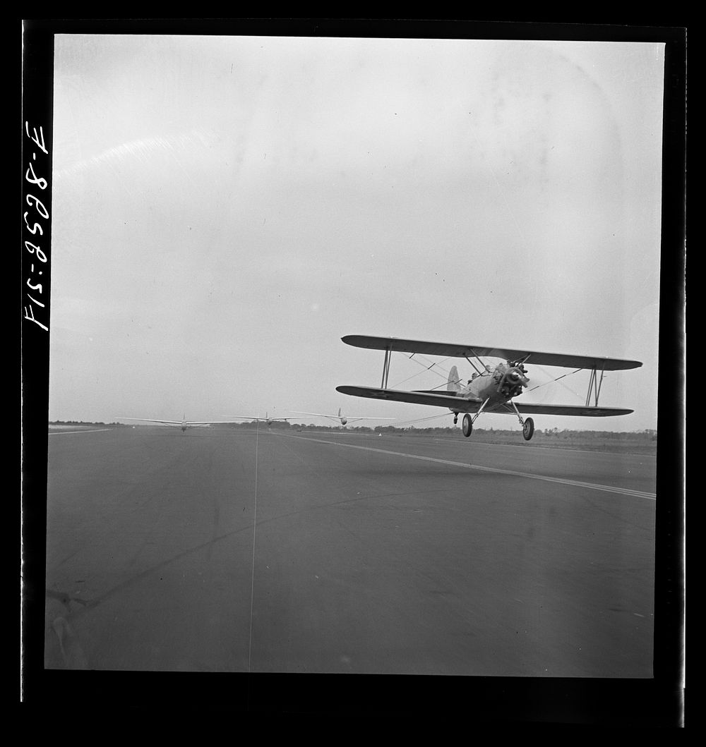 [Untitled photo, possibly related to: Parris Island, South Carolina. An aerial "tug boat" towing three gliders across the…