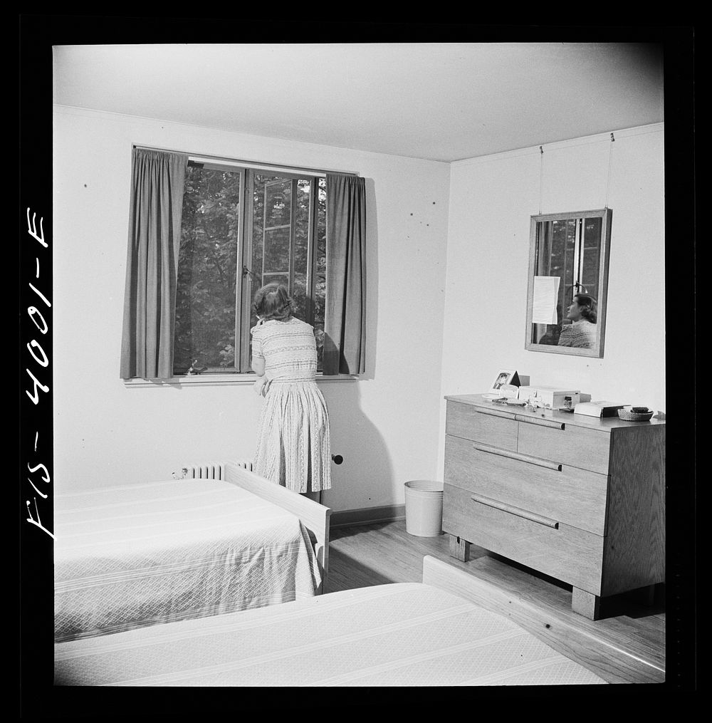 Greenbelt, Maryland. Bedroom of a house which is furnished in special skills furniture. Sourced from the Library of Congress.