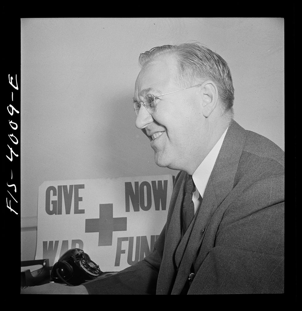 Washington, D.C. Mr. Lund, who is the head of the District Red Cross, at his desk in the District chapter house. Sourced…