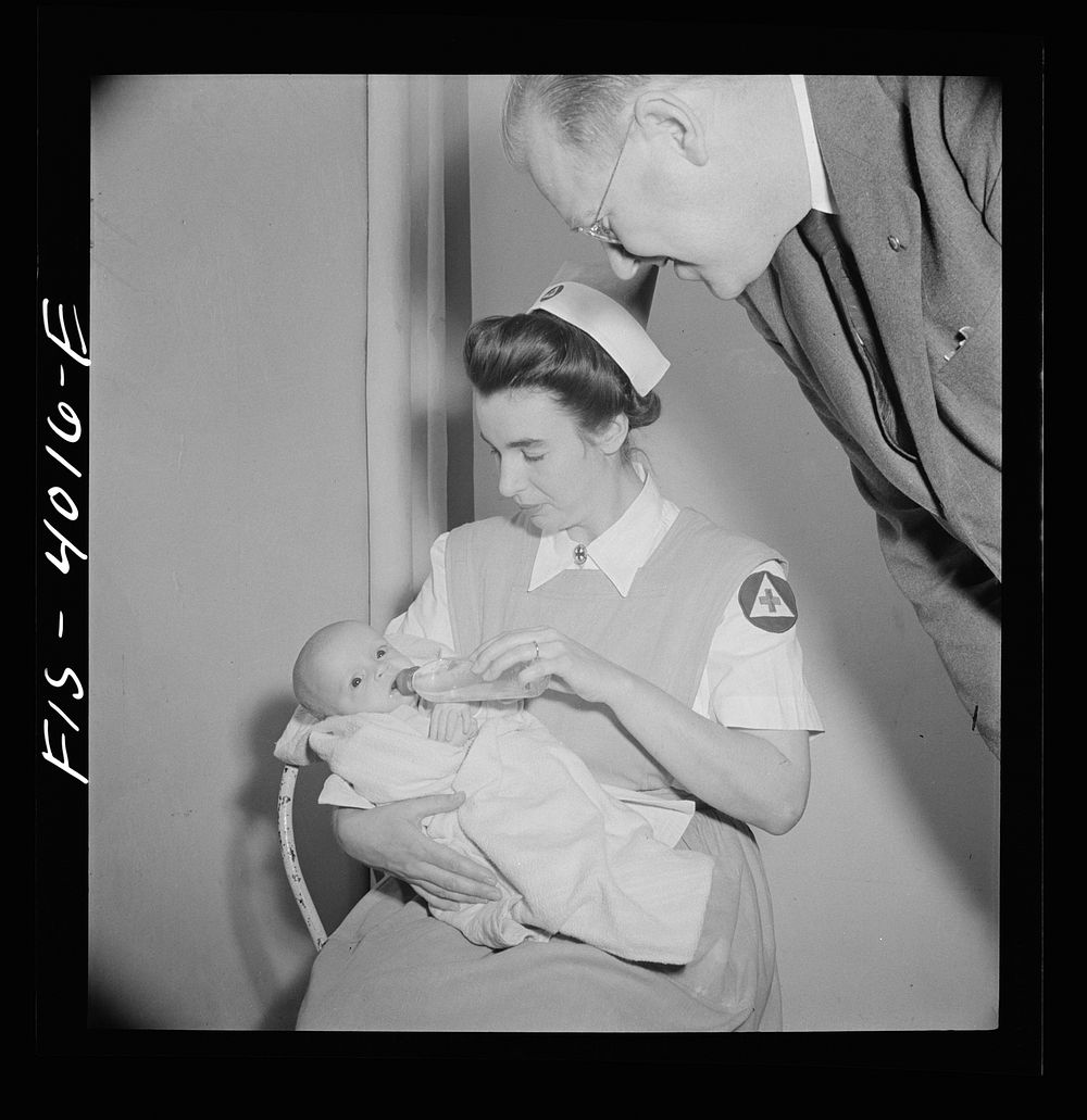 Washington, D.C. Mr. Lund, who is the head of District Red Cross, visits Children's Hospital, where General MacArthur's…